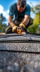 Roofing Contractor Installing Asphalt Shingles Outdoors