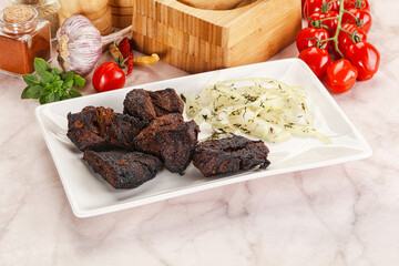 Grilled beef barbecue served onion