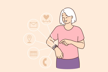 Fitness bracelets or smartwatch on hand elderly woman using gadget to make call or measure heartbeat