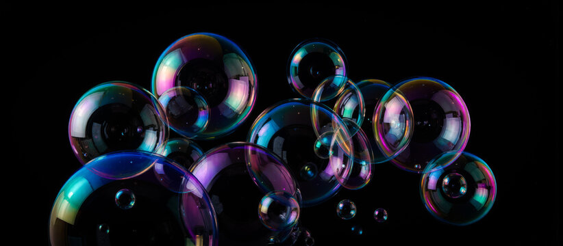 Colorful soap bubbles floating in dark space with reflections and light effects creating magical dreamy atmosphere, perfect for backgrounds overlay