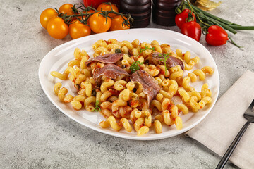 Italian pasta cellentani with anchovy