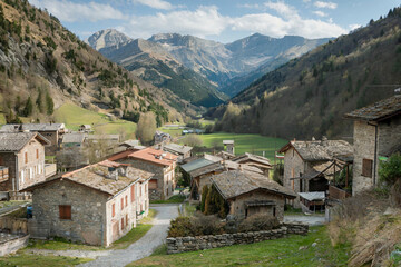 Picturesque mountain village nestled in the valley surrounded by stunning peaks