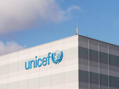 Unicef blue logo and name on Nordhavn building facade; global humanitarian hub, Copenhagen, Denmark