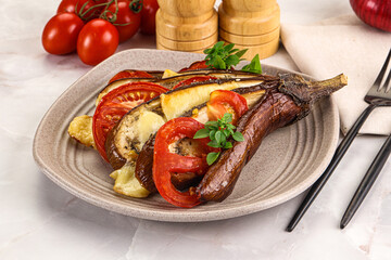 Baked tomato with mozzarella and tomato