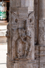 Intricate stone carvings at Srirangam Sriranganathaswamy Temple in Trichy, Tamil Nadu showcasing divine figures