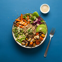 Healthy Vegan Buddha Bowl with Avocado, Quinoa, and Roasted Vegetables