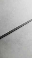 Fototapeta premium Minimalist Black Line on Grey: A clean, minimalist photograph featuring a sleek black line against a textured grey background.