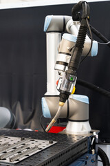 Automatic welding robot in a modern factory in operation