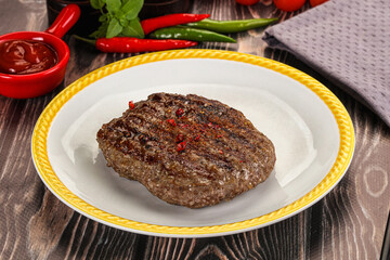 Grilled beef burger cutlet with sauce