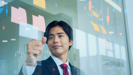 プランを練るビジネスマンと金融データイメージ
