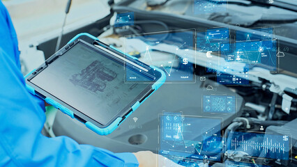 Automotive mechanic inspecting the engine compartment of a car and digital data concept