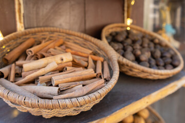 Obraz premium Traditional spices market. Pots and wooden tubs stand in row with tea, spices, fruits, roots, flowers. Street bazaar.