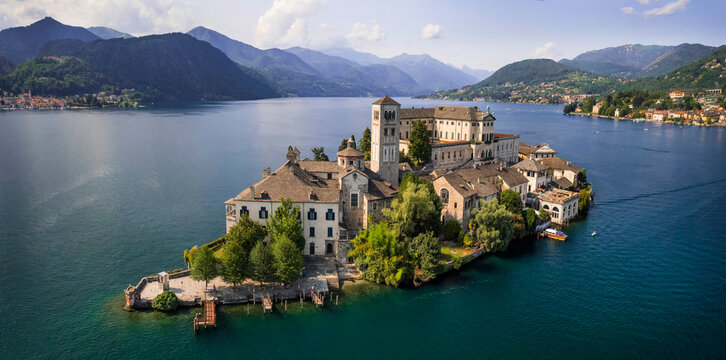Aerial View of Isola San Giulio in Lake Orta: Iconic Monastery Island and Medieval Village, Piedmont Alps Region Novara Province Northern Italy, UNESCO Heritage Site Panoramic