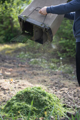 Composting of cut grass and fallen leaves to enrich soil