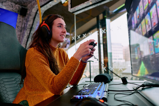 Woman enjoying video game in a modern gaming room