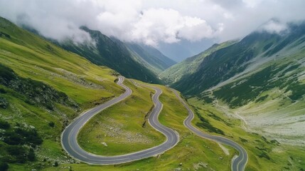 A breathtaking mountain pass with a winding road through dramatic landscapes.