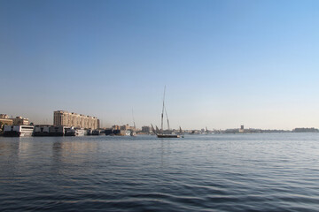 Felucca sailing on Nile River in a sunny afternoon at Aswan, Egypt