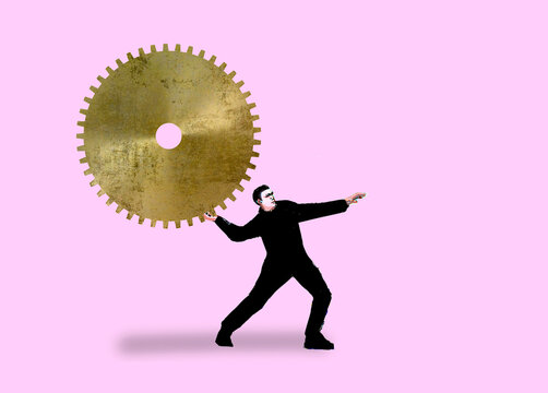 Person throwing a large gear against a pink background symbolizing work and frustration