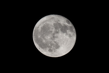 Full moon over dark black sky