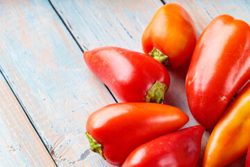 Farm-to-Table Bell Peppers with Vibrant Colors on Wooden Surface for Seasonal Cooking, Copy Space