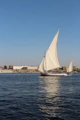 Felucca sailing on Nile River in a sunny afternoon at Aswan, Egypt