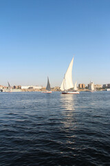 Felucca sailing on Nile River in a sunny afternoon at Aswan, Egypt
