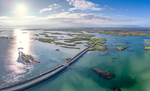 Drone aerial view of North Ford causeway crossing in North Uist, Scotland, showcasing a vital transport link and engineering feat in a scenic travel destination.