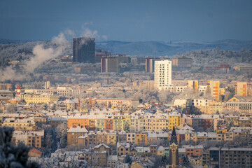 Fototapeta premium Brno, Czech Republic - View of the winter snowy city center. Buildings and streets in winter.