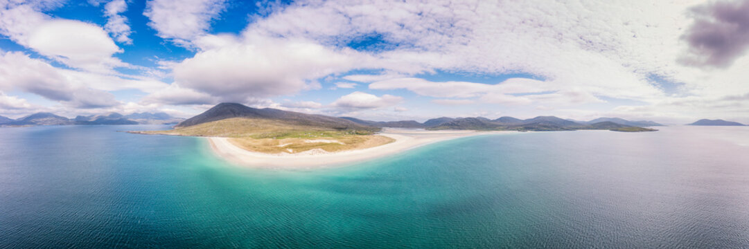 Aerial view of Luskentyre beach in Harris, Scotland, showcasing white sands and turquoise waters.