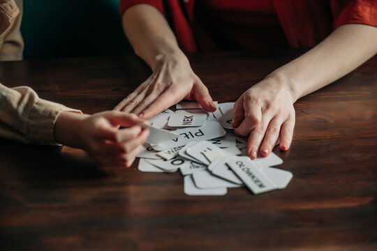 Mother and son learning with cards at home