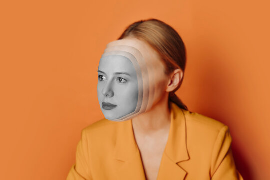 Creative portrait of a woman with a layered face effect wearing a yellow jacket