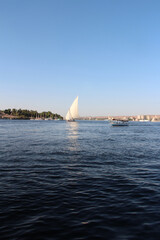 Felucca sailing on Nile River in a sunny afternoon at Aswan, Egypt