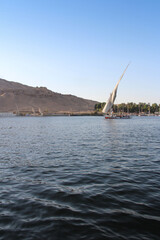 Felucca sailing on Nile River in a sunny afternoon at Aswan, Egypt