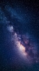 Obraz premium Celestial Canvas: The night sky unveils a breathtaking tapestry of stars and cosmic dust, showcasing the majestic Milky Way in all its glory.