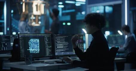 Asian Researcher Making a Quantum Computing Experiment, Monitoring Live Artificial Intelligence Data on Computer Screen, Running Software Code in Terminal Window. Developer Solving a Problem - Powered by Adobe