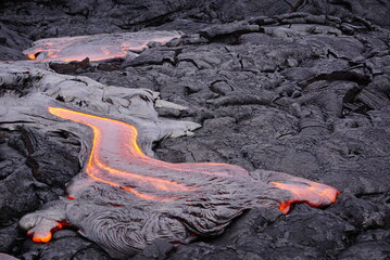 Hot magma flows  over old lava field