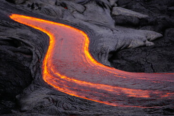 Hot magma flows  over old lava field