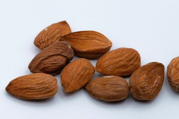 High-angle view of almonds on white background