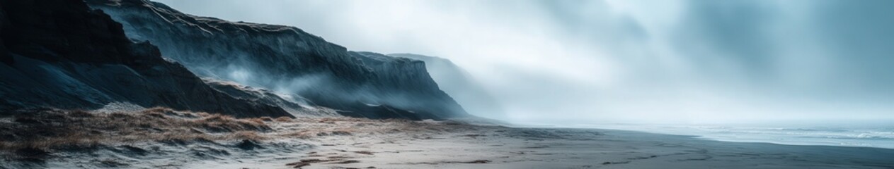 Fototapeta premium Fog enveloping a serene coastline at dawn in nature's beauty