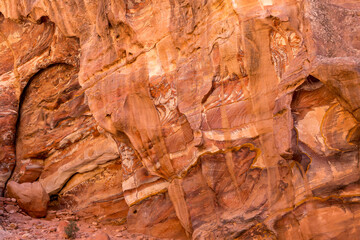 Sandstone rock and mineral layers in Petra, Jordan