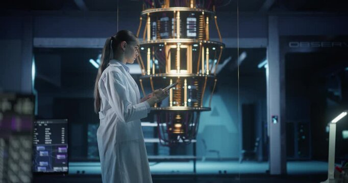Portrait of a Female Researcher Standing Next to a Powerful Quantum Processor, Using a Tablet Computer to Monitor Digital Data. Thoughtful Young Woman is Analyzing Results and Parameters Online