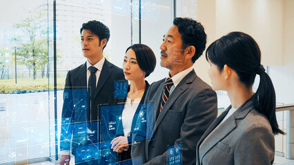 Obraz premium 会社員グループとデジタルデータ