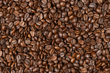 Decaffeinated coffee beans roasted close up top view
