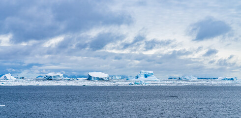 Antarctic landscapes, seascapes, and icescapes in melting environment.