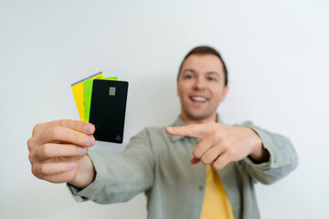Photo of positive nice man arm demonstrate plastic card nfc payment