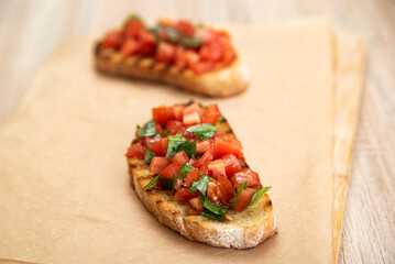Bruschetta with tomatoes and basil prepared for breakfast