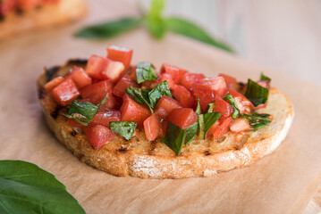 Bruschetta with tomatoes and basil prepared for breakfast