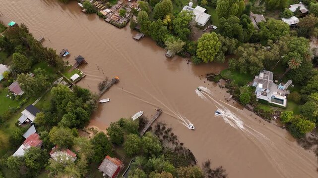 Aerial view of jet skis on the water of the Tigre Creek Delta in Buenos Aires.
