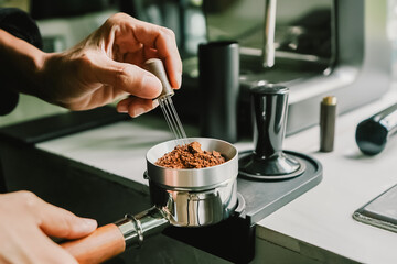 Close-up of coffee powder spreading in the brewing handle to prepare a coffee drink menu.
