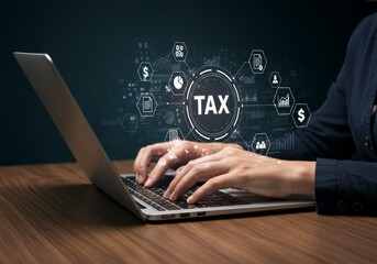 Hands typing on laptop with digital tax graphics overlay.